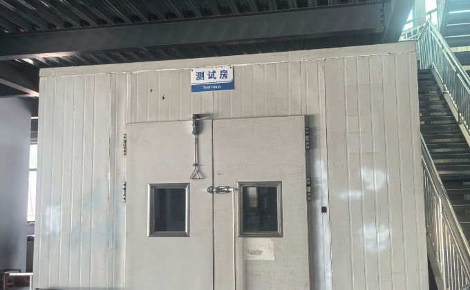 Exterior view of a white sealed test chamber used for freezer performance testing, reflecting stringent quality control.