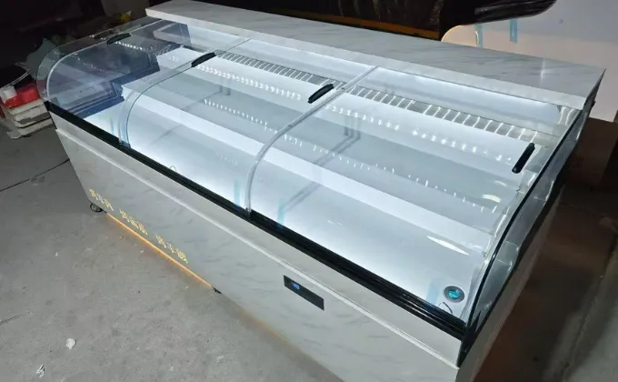 A customized specialty meat store freezer featuring a premium marble texture finish and gold decorative details to match upscale retail interior designs.