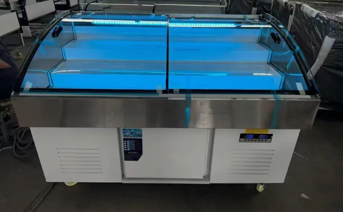 A white stepped chest display freezer with internal blue LED lighting, designed for BBQ restaurants to display skewers and meat ingredients with three-level visibility.