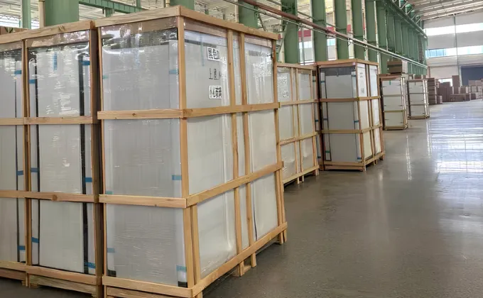 Commercial island chiller secured in a reinforced wooden crate with protective film for safe long-distance international shipping.