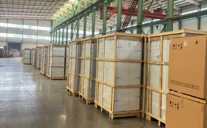 Commercial freezers protected with film, cartons and wooden frames for shipment